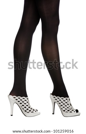 Woman With Long Legs In Black Stockings Wearing Leather Mule Shoes On ...