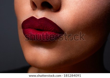 closeup of womanÃ?Â¢??s sexy lips with red ombre style lipstick on tanned skin