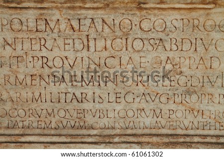 ancient stone with Latin text in upper case in Ephesus, Turkey.