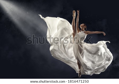 Ballerina Jumping in White Silk Dress, Modern Ballet Dancer in Pointe Shoes, Fluttering Waving Cloth, Gray Background