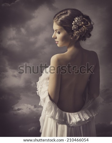 Woman fashion dress, retro hair style, elegant girl in gown with naked back, historical romance portrait