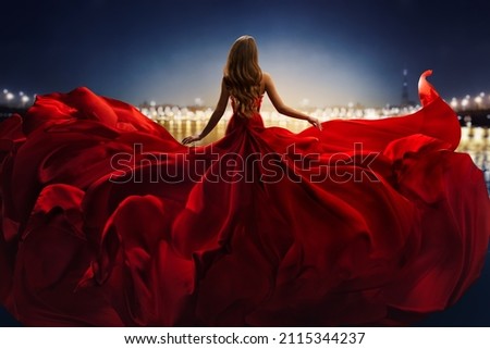 Fashion Woman in Red fluttering Dress Back Side Rear View. Glamour Model dancing with Long Silk Fabric flying on Wind over Night Sky City Light Landscape Stock foto © 