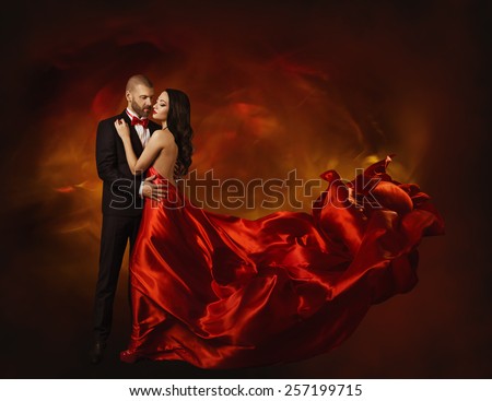 Elegant Couple Dancing in Love, Woman in Red Clothes and Lover Man in Classic Suit, Long Waving Dress Tail, Fashion Beauty Portrait
