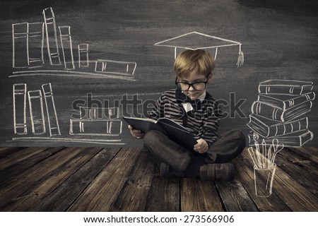 Child Little Boy in Glasses Reading Book over School Black Board with Chalk Drawing, Kids Preschool Development, Children Education Concept