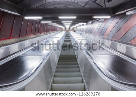 modern escalator in futuristic building