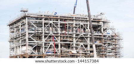 Panorama Assembling of liquefied natural gas Refinery Factory with LNG storage tank using for Oil and gas industry background
