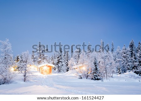 Winter landscape with cabin hut at night in Kiruna Sweden at Night