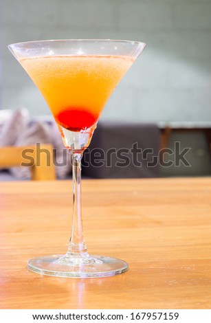 cup of cherry Cocktail with bar background