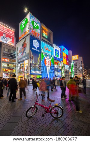 OSAKA, JAPAN - DEC 2: The famed advertisements of Dotonbori on December 2, 2013 in Osaka, Japan. With a history reaching back to 1612, the district is now one of Osaka\'s primary tourist destinations.