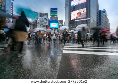 TOKYO - FEB 18: Pedestrians cross at Shibuya Crossing on Febuary 18, 2015 in Tokyo, Japan. The crosswalk is one of the world\'s most famous implementations of a scramble crosswalk.
