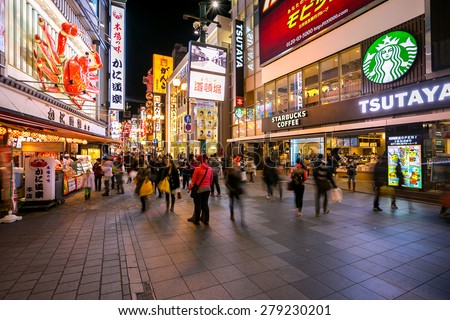 OSAKA, JAPAN - FEB 9: Unidentified tourists are shopping at Dotonbori on Febuary 9, 2015 in Osaka, Japan. With a history reaching back to 1612, the districtis now one of Osaka\'s tourist destinations.