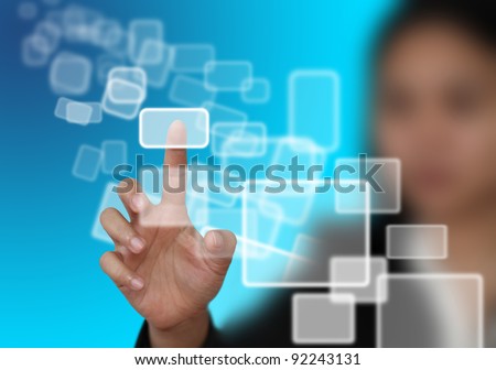 woman hand push on technology virtual touch screen interface (selective focus at finger)