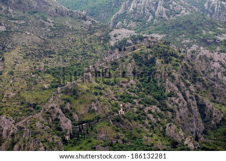 Paths on switchbacks up steep mountain in Montenegro