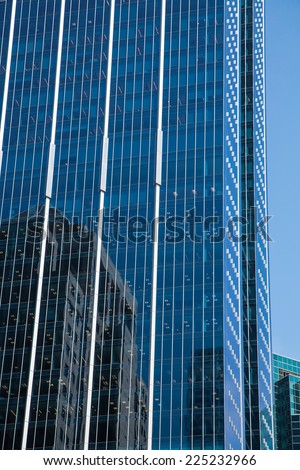 Buildings reflected in a modern glass office tower in Chicago