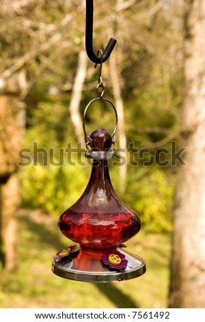 An old fashioned oil lamp hanging on a deck