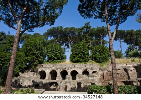 Old arches under trees at the ruins of the ancient Roman Empire