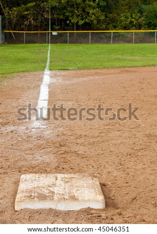 The baseline in a neighborhood baseball field