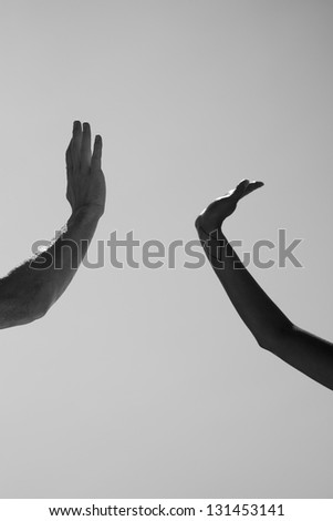 black and white high five