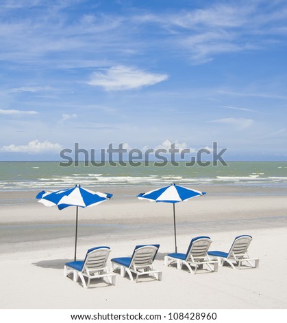 summer tropical beach with blue sky with umbrella and chair