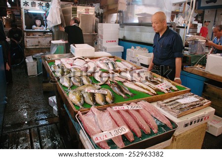 TOKYO - JULY 19 : Fish seller at Tsukiji Market, the biggest wholesale market in Japan taken July 19, 2008 in Tokyo, Japan.
