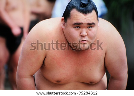 TOKYO JAPAN - APRIL 11 : An unidentified Sumo wrestler competes in Yasukuni Shrine during the sumo spring tournament on April 11, 2007 in Tokyo, Japan