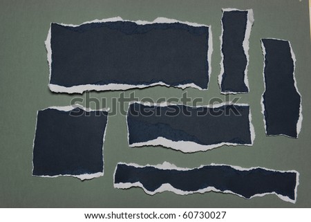 Pieces of Rip Paper with white edges isolated on a green background
