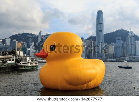 HONG KONG - JUNE 7: the giant duck in Hong Kong on June 7 2013. :Yellow Duck Sculpture By Florentijn Hofman outside Harbour City Mall in Hong Kong City.