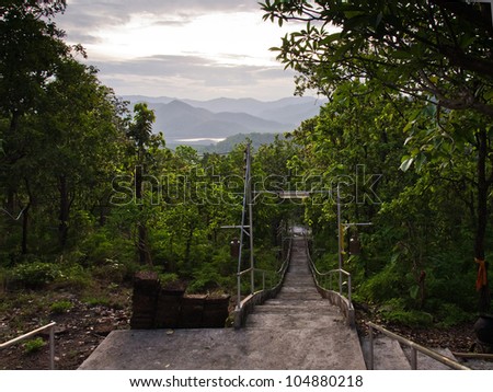 Old concrete stairway downward the mountain in Thailand