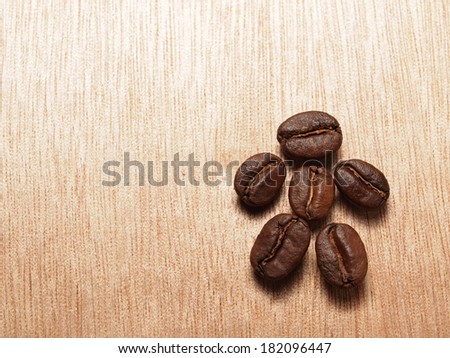 Roasted Coffee Beans on wood texture table