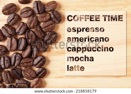 Coffee crop beans with coffee menu on wood texture background