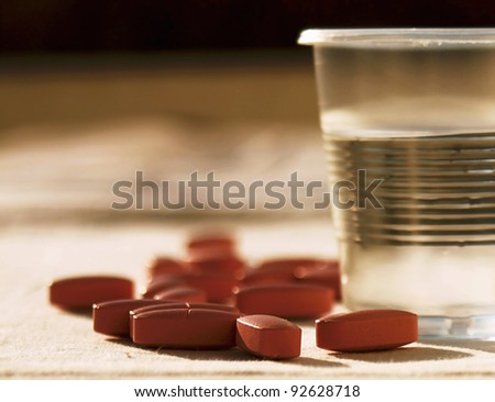 Pills with cup of water