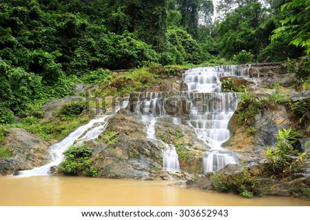 Deep forest waterfall , The waterfall named Mae Phlu  waterfall in  Uttaradit province ,  Thailand