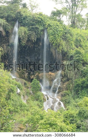 Paradise waterfall in Tropical rain forest of Thailand , water fall in deep forest at Tak province Thailand .The waterfall named Thararuk waterfall