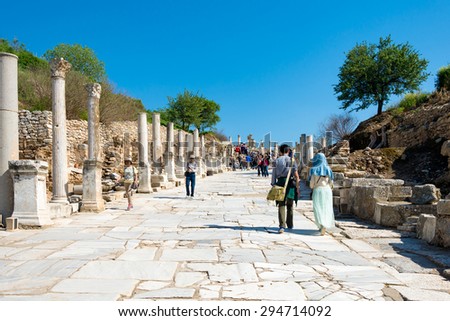 EPHESUS, TURKEY - APRIL 13 :  Tourists in Ephesus Turkey on April 13, 2015. Ephesus contains the ancient largest collection of Roman ruins in the eastern Mediterranean