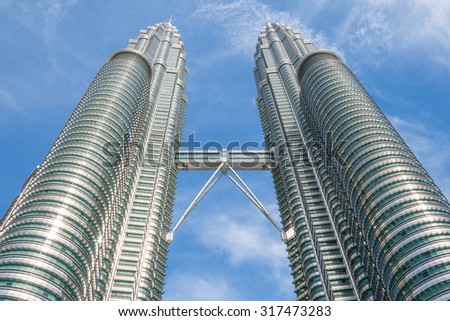 KUALA LUMPUR,MALAYSIA - JULY 11, 2009: The Petronas Towers,Petronas Twin Towers are twin skyscrapers in Kuala Lumpur, Malaysia. Malaysia.Malaysia is a member of Asean Economic Community (AEC)