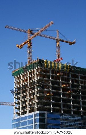 Industrial construction cranes and building work site