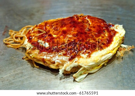 Okonomiyaki Japanese food or aka noodle with japanese pancake on top with sweet sauce