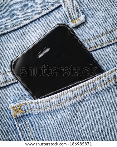 black smart phone in jeans pocket