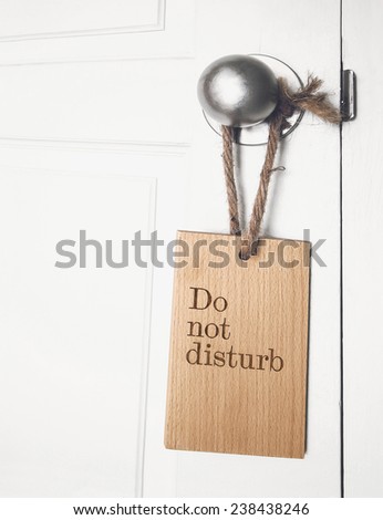 do not disturb sign hanging on the doorknob