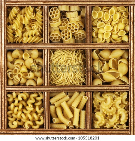different kinds of italian pasta in wooden box catalog.