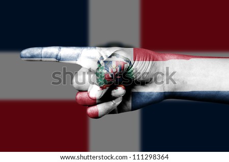 Human hand point with finger in Dominican Republic national flag
