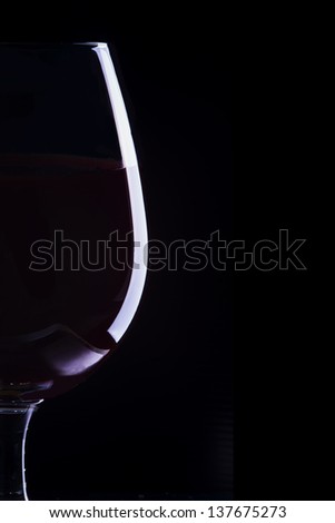 stock-photo-glass-of-red-wine-on-black-137675273.jpg