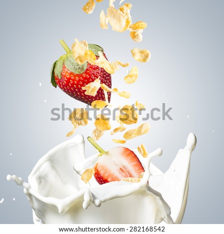 Corn Flakes With Milk Splash and Strawberry. Healthy Breakfast