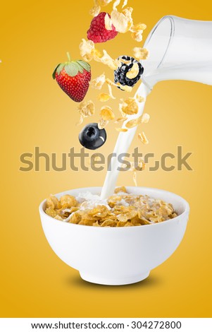 Various Berries, Blackberry, Blueberry, Strawberry, And Raspberry Falling Into Corn Flakes With Milk Splash