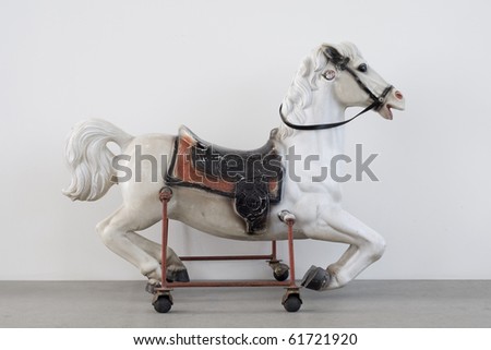 Vintage Children horse riding toy isolated on white background
