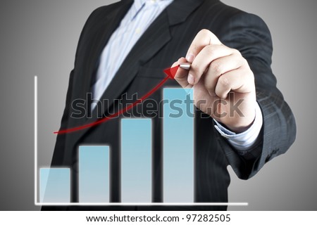 Businessman drawing graph on the screen. Concept for business growth