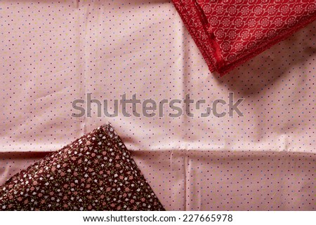 set of folded tissue intoning to red orange