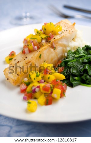 Sea bass with mango salsa, mashed potato and spinach
