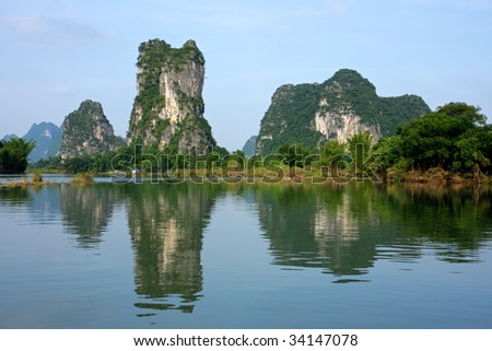 Limestone hills reflected in the waters of the Li-river, Yangshou, China