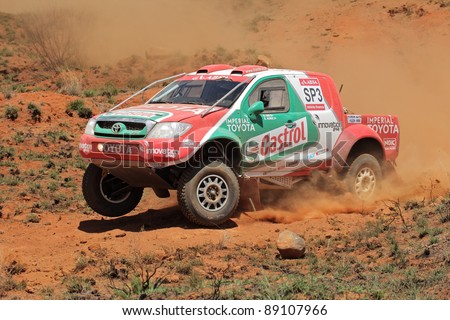 BLOEMFONTEIN, SOUTH AFRICA - OCTOBER 15: Duncan Vos and Rob Howie in their Toyota Hilux in action during a South African off road championship event in Bloemfontein, South Africa on October 15, 2011